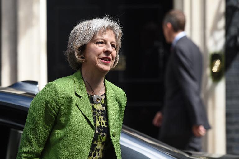 British Home Secretary Theresa May says Britain will not participate in a mandatory system of resettlement for refugees