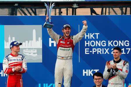 Formula E - FIA Formula E Hong Kong ePrix - Hong Kong - December 3, 2017 ABT Schaeffler Audi Sport's Daniel Abt of Germany celebrates with Mahindra's Felix Rosenqvist of Sweden and Venturi's Edoardo Mortara of Italy fter winning the race. REUTERS/Tyrone Siu