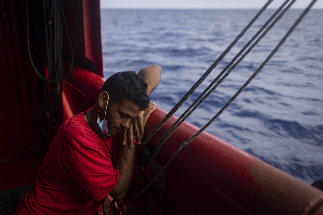 A migrant from Egypt rests aboard the Ocean Viking, a search and rescue ship run by NGO SOS Mediterranee and the International Federation of Red Cross (IFCR), Sunday, Aug 28, 2022 while waiting for the third day for the Italian government to allocate a port to disembark. (AP Photo/Jeremias Gonzalez).