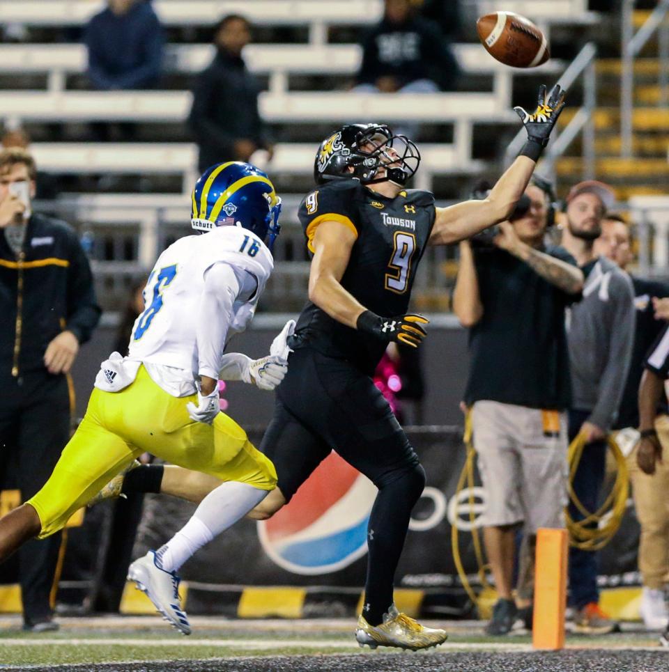 Towson's Sam Gallahan pulls in the go-ahead touchdown pass in front of Delaware defensive back Nijuel Hill with 35 seconds left in Towson's 18-17 win at Johnny Unitas Stadium in Towson, Md. Saturday.