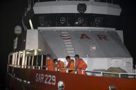 Members of National Search and Rescue Agency (BASARNAS) prepare for a search mission for The Indonesian Navy submarine KRI Nanggala at Benoa harbor in Bali, Indonesia on Wednesday, April 21, 2021. Indonesia's navy is searching for the KRI Nanggala submarine that went missing north of the resort island of Bali with a number of people on board, the military said Wednesday, April 21, 2021.(AP Photo/Firdia Lisnawati)