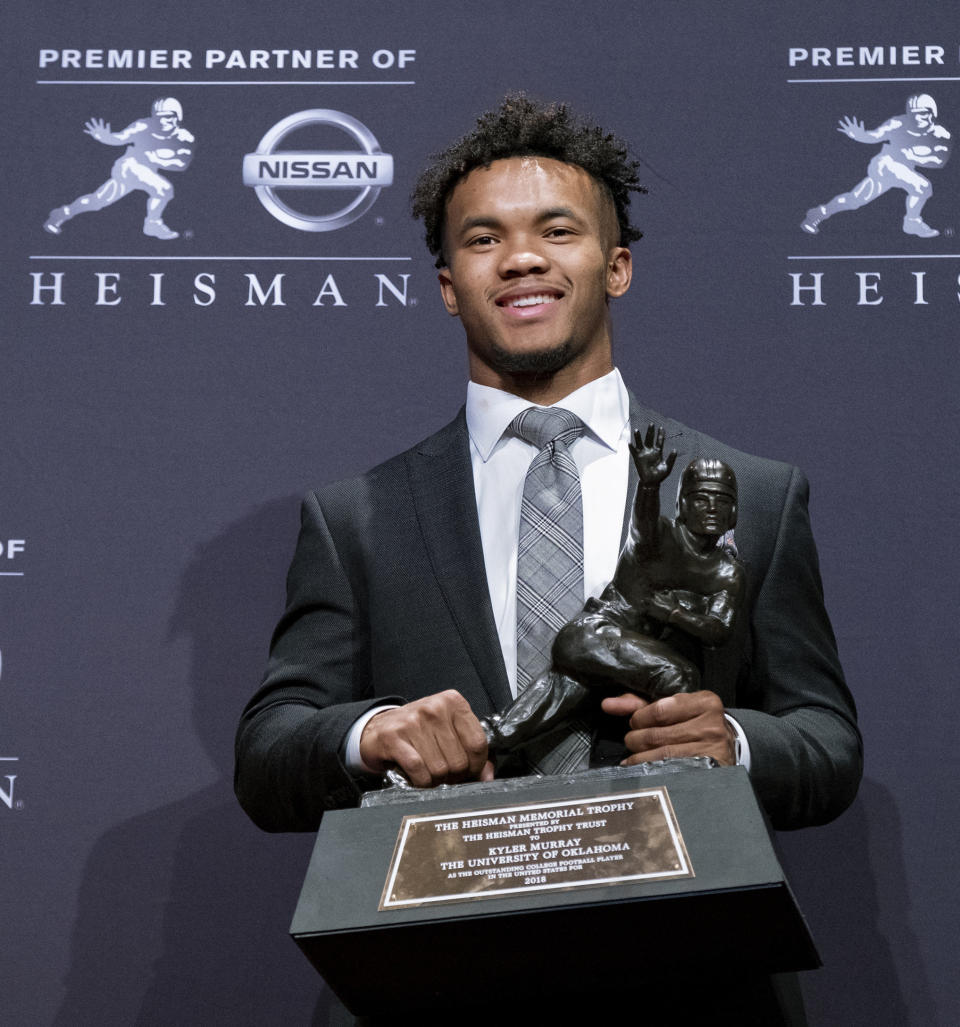 Oklahoma quarterback Kyler Murray poses with the Heisman Trophy after winning the award Saturday in New York. (Photo: ASSOCIATED PRESS)