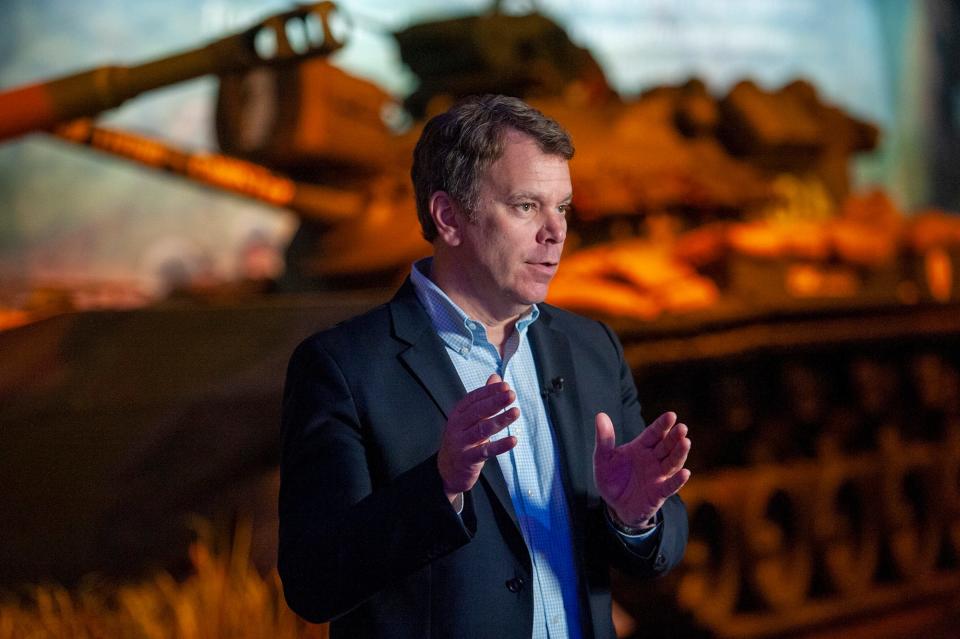 Rob Collings, president of the American Heritage Museum in Hudson, speaks in front of a new exhibit featuring two original cells that held American POWs during the Vietnam War, Feb. 9, 2023.