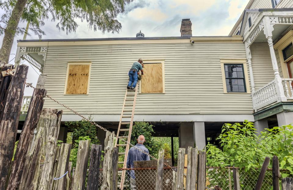 The windows of a raised historic house are boarded up as residents prepare for the arrival of Hurricane Francine along the Louisiana coast on Monday, Sept. 9, 2024, in Lafitte, La. (Chris Granger/The Times-Picayune/The New Orleans Advocate via AP)