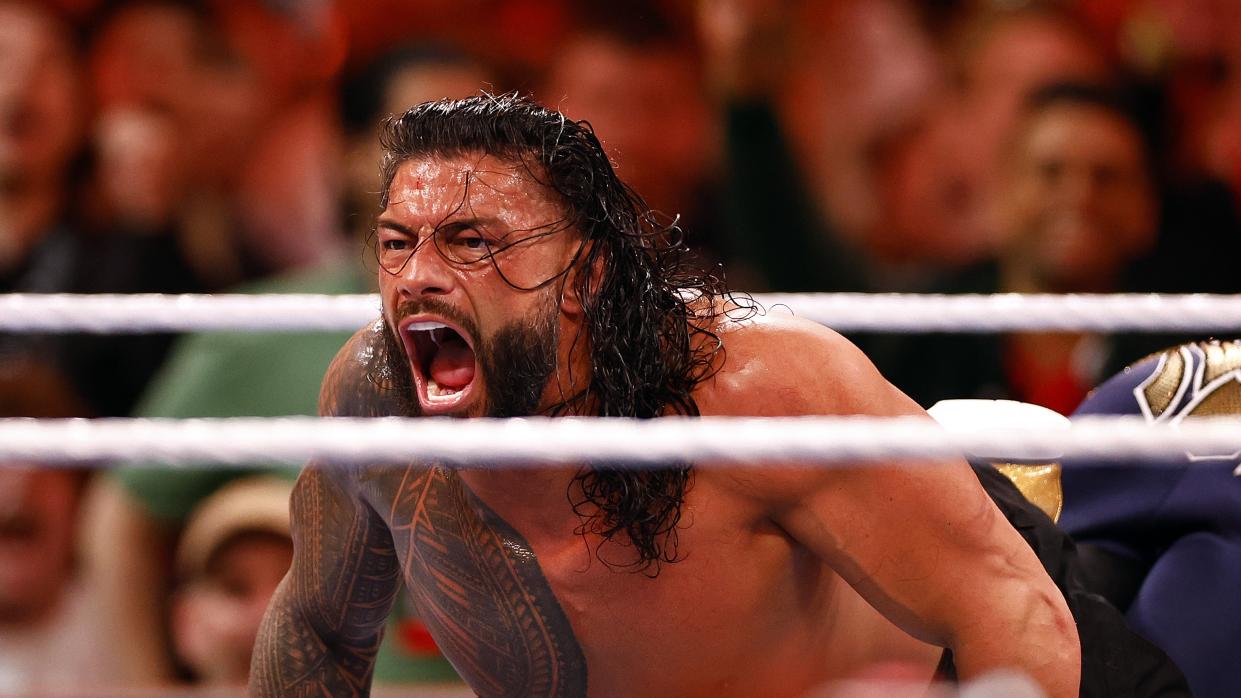  WWE wrestler Roman Reigns lets out a scream as he goes down in the ring ahead of the WWE Money in The Bank 2023 event. 