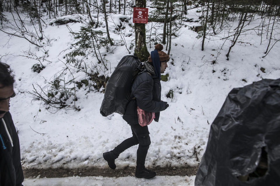 A group of Afghan migrants walk through the mountains in an area believed to have been mined during the Bosnian war, as they attempt to cross the border into Croatia near Bihac, northwestern Bosnia on Dec. 15, 2019. (Photo: Manu Brabo/AP)