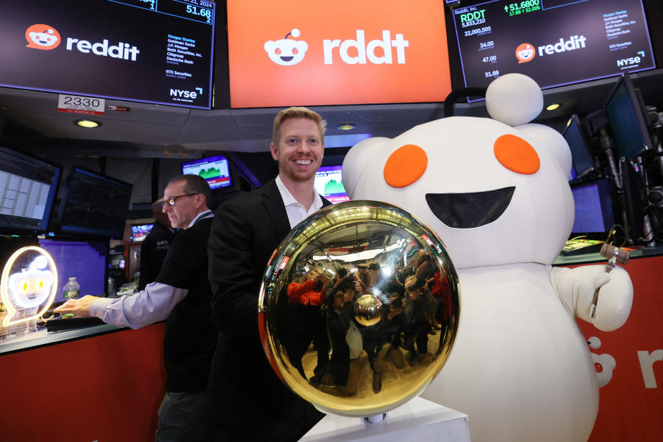CEO of Reddit Steve Huffman stands next to Snoo, the mascot of Reddit, at the New York Stock Exchange (NYSE) in New York City, U.S., March 21, 2024. REUTERS/Brendan McDermid