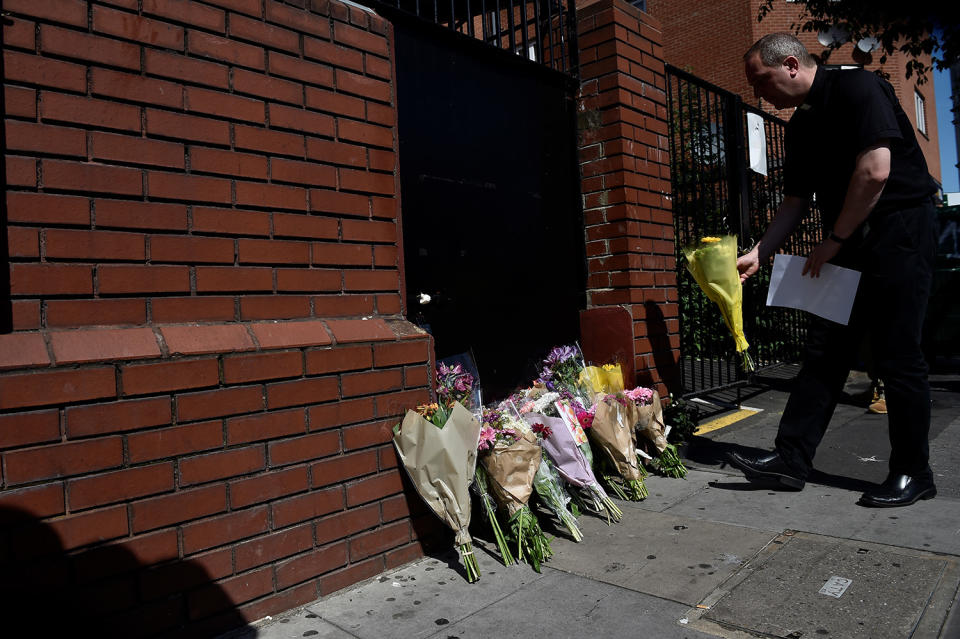 <p>A priest leaves flowers near the scene of an attack where a van was driven at Muslims outside a mosque in Finsbury Park in North London, Britain, June 19, 2017. (Photo: Hannah McKay/Reuters) </p>