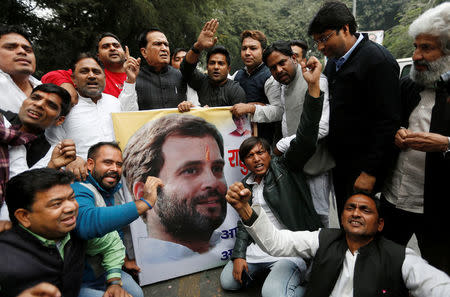 Workers from India's main opposition Congress Party celebrate after the party announced Rahul Gandhi as its president outside the party's headquarters in New Delhi, India December 11, 2017. REUTERS/Adnan Abidi