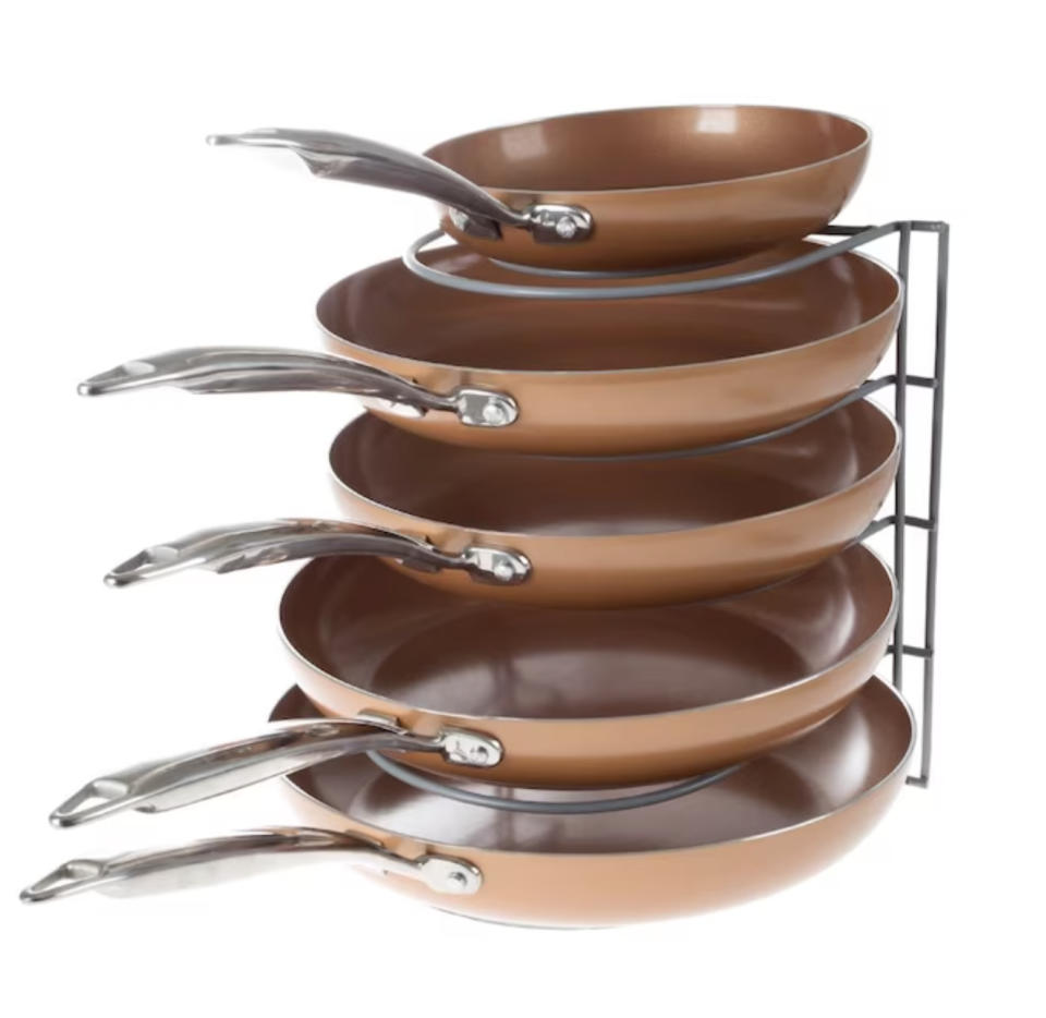 pans stacked on metal organizer