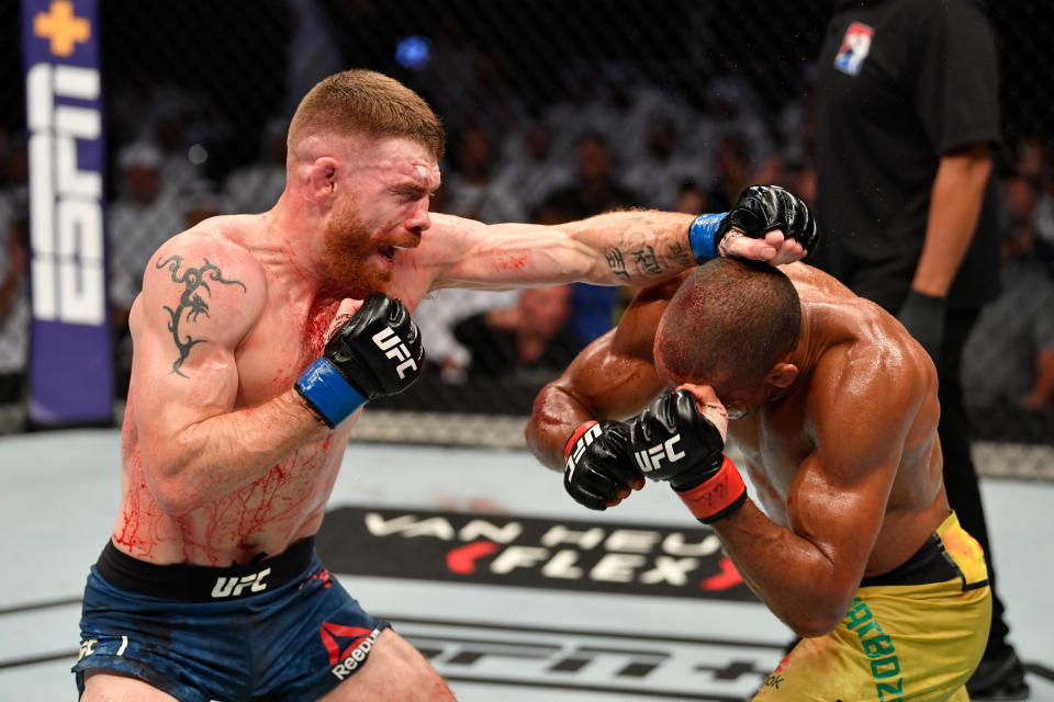 ABU DHABI, UNITED ARAB EMIRATES - SEPTEMBER 07:  (L-R) Paul Felder punches Edson Barboza of Brazil in their lightweight bout during UFC 242 at The Arena on September 7, 2019 in Yas Island, Abu Dhabi, United Arab Emirates. (Photo by Jeff Bottari/Zuffa LLC/Zuffa LLC via Getty Images)