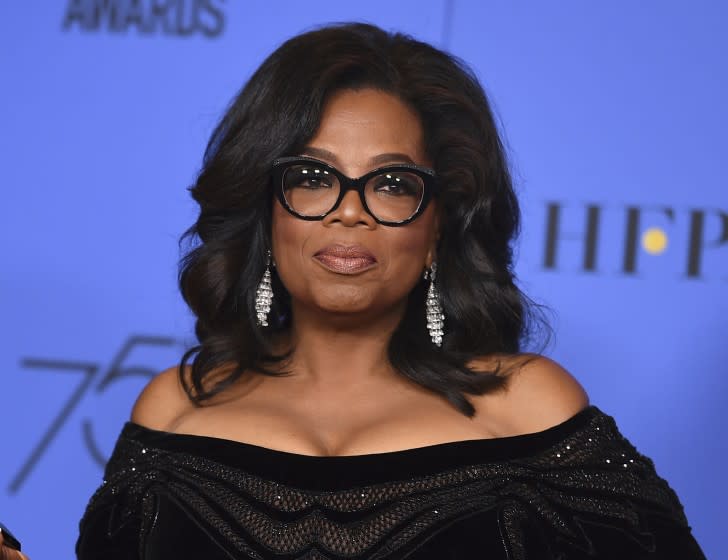 FILE - In this Jan. 7, 2018 file photo, Oprah Winfrey poses in the press room with the Cecil B. DeMille Award at the 75th annual Golden Globe Awards in Beverly Hills, Calif. Winfrey will interview two men who say Michael Jackson sexually abused them as boys immediately after a documentary on the men. HBO and the Oprah Winfrey Network announced Wednesday that “After Neverland,” will air on both channels Monday at 10 p.m. Eastern and Pacific. (Photo by Jordan Strauss/Invision/AP, File)