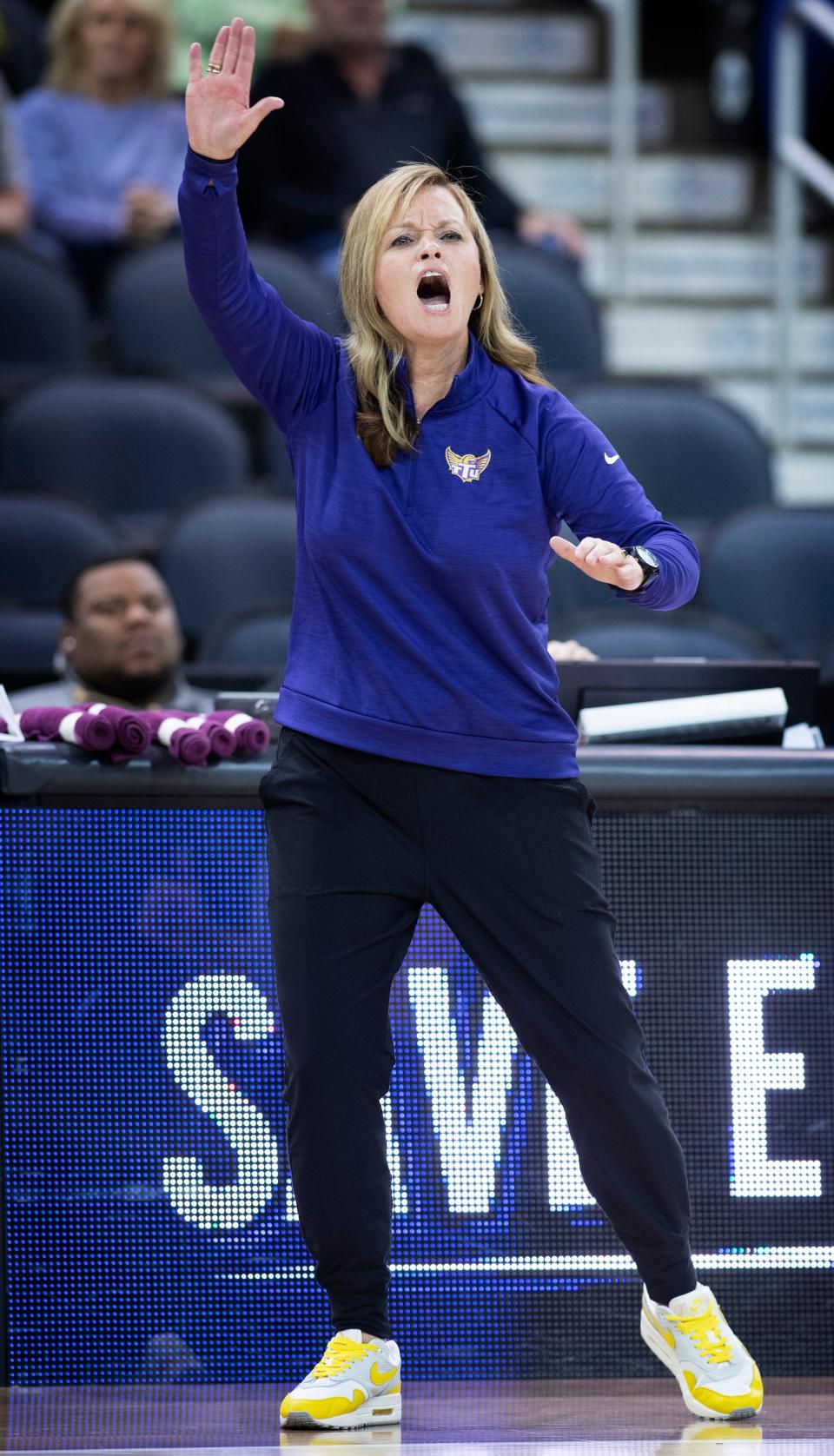 Tennessee Tech Head Coach Kim Rosamond calls plays from the sideline against Southern Illinois-Edwardsville during their quarterfinal game of the Ohio Valley Conference Women's Basketball Championship at Ford Center in Evansville, Ind., Thursday afternoon, March 2, 2023.