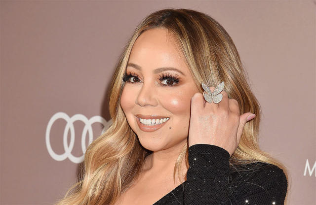 When cover-ups go wrong: Mariah Carey's boob pops out in wetsuit