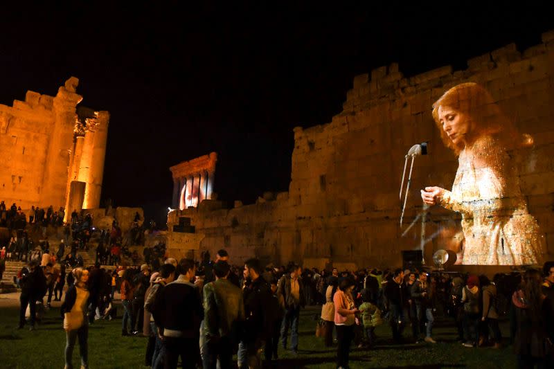 FILE PHOTO: Pictures of Lebanese singer Fairouz are projected on the Roman ruins of the Baalbek Temples, in an event to celebrate her birthday, in the Bekaa valley