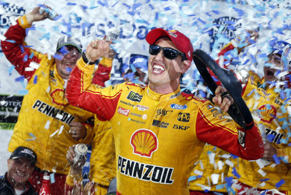 Joey Logano celebrates after winning the Monster Energy NASCAR Cup Series auto race at Martinsville Speedway in Martinsville, Va., Sunday, Oct. 28, 2018. (AP Photo/Steve Helber)