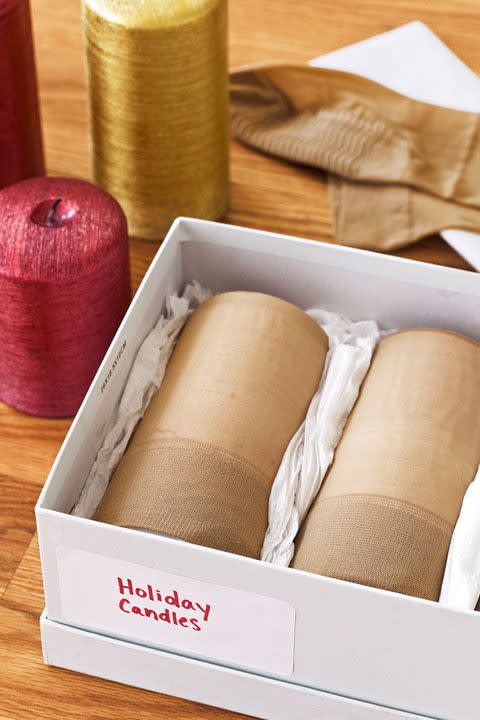 <p>Old hosiery can protect specialty candles from getting damaged. Slip knee-highs over the pillars to keep them dust-free. Then, nestle them in tissue paper to prevent dents or scratches and stow away from heat or pressure — they can melt or warp the wax.</p>