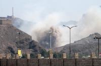 Smoke billows from the site of an explosion that hit an arms depot in Yemen's second city of Aden on March 28, 2015