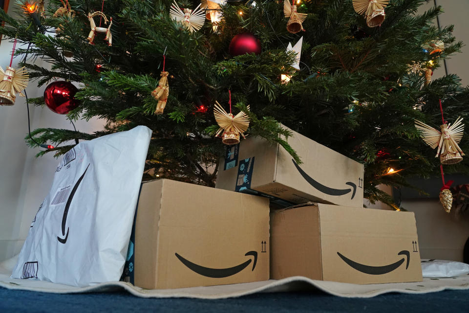 Packages from Amazon under a Christmas tree. (Photo by Sean Gallup/Getty Images)