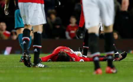 Soccer Football - Premier League - Manchester United vs Southampton - Old Trafford, Manchester, Britain - December 30, 2017 Manchester United's Romelu Lukaku after sustaining an injury REUTERS/Andrew Yates