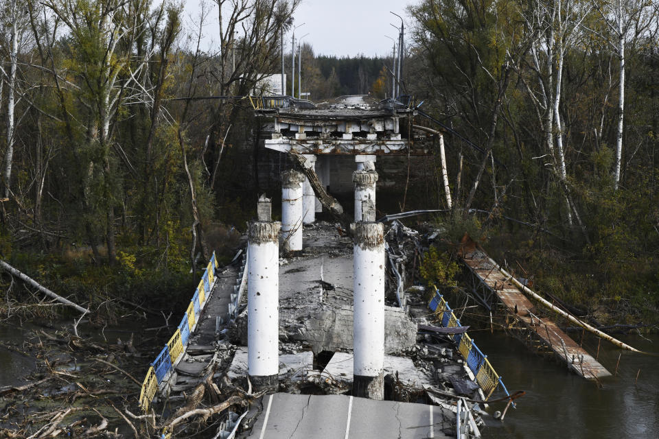 A view of a damaged bridge in the retaken village of Bohorodychne, eastern Ukraine, Saturday, Oct. 22, 2022. (AP Photo/Andriy Andriyenko)