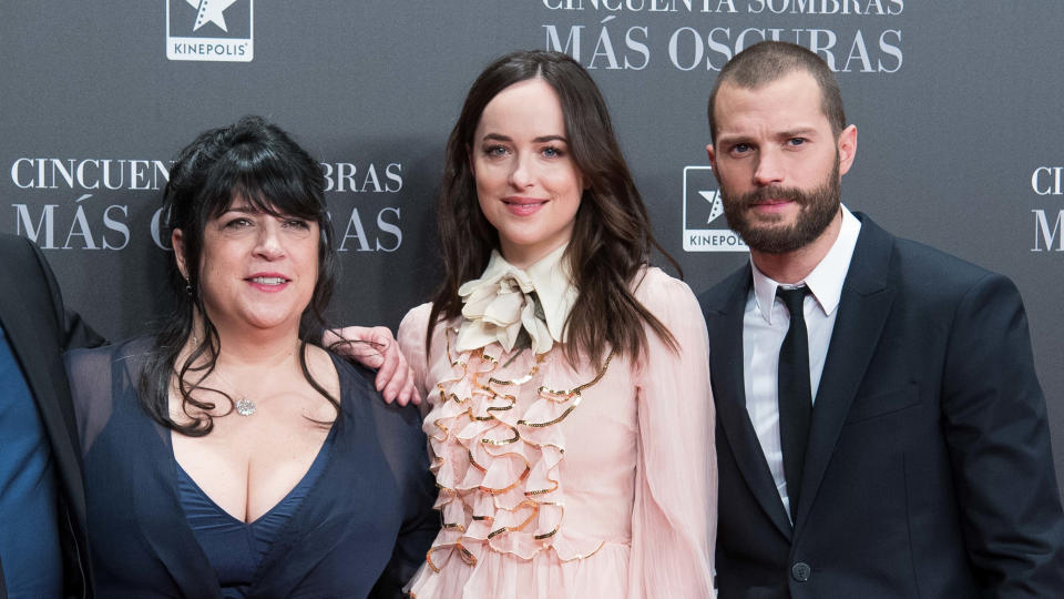 E. L. James joins 'Fifty Shades' film series stars Dakota Johnson and Jamie Dornan on the red carpet. (Gabriel Maseda/NurPhoto via Getty Images)