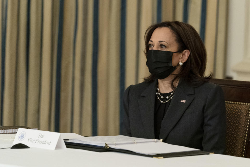 Vice President Kamala Harris listens during a virtual meeting with President Joe Biden, Indian Prime Minister Narendra Modi, Australian Prime Minister Scott Morrison and Japanese Prime Minister Yoshihide Suga, from the State Dining Room of the White House, Friday, March 12, 2021, in Washington. (AP Photo/Alex Brandon)