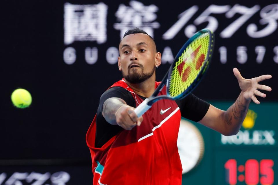 Nick Kyrgios reaches for a volley at the net (AP)