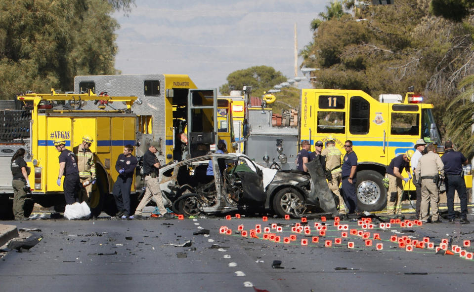 Members of the Clark County Fire Department and the Las Vegas Metropolitan Police Department work the scene of a fatal accident on Nov. 2 in Las Vegas. (Ethan Miller / Getty Images)