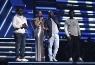 Nathan Morris, from left, Wanya Morris, Shawn Stockman, of Boyz II Men‎, and Alicia Keys, second left, sing a tribute in honor of the late Kobe Bryant at the 62nd annual Grammy Awards on Sunday, Jan. 26, 2020, in Los Angeles. (Photo by Matt Sayles/Invision/AP)