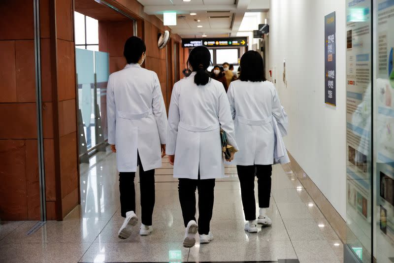 Medical workers walk at Severance Hospital in Seoul