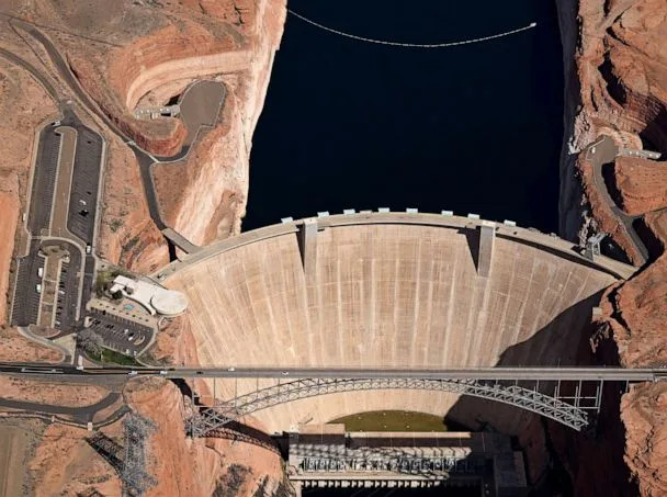 PHOTO: Glen Canyon Dam holds back Colorado River water to create Lake Powell on April 15, 2023 in Lake Page, Arizona. (RJ Sangosti/MediaNews Group/The Denver Post via Getty Images)