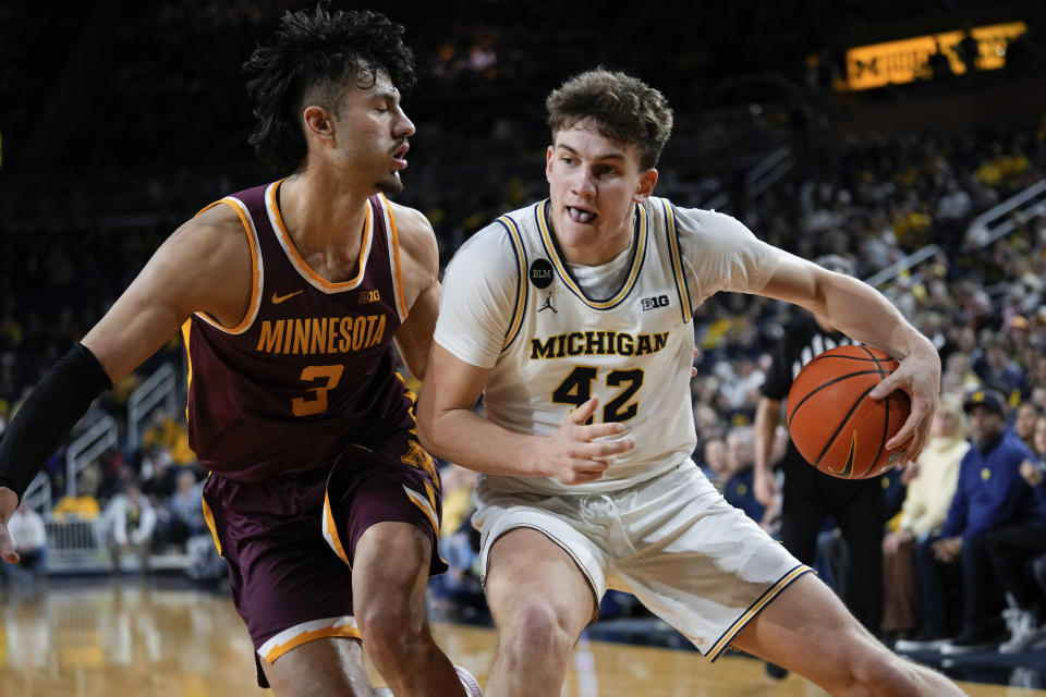 Michigan forward Will Tschetter (42) drives on Minnesota forward Dawson Garcia (3) in the second half of an NCAA college basketball game in Ann Arbor, Mich., Sunday, Jan. 22, 2023. (AP Photo/Paul Sancya)