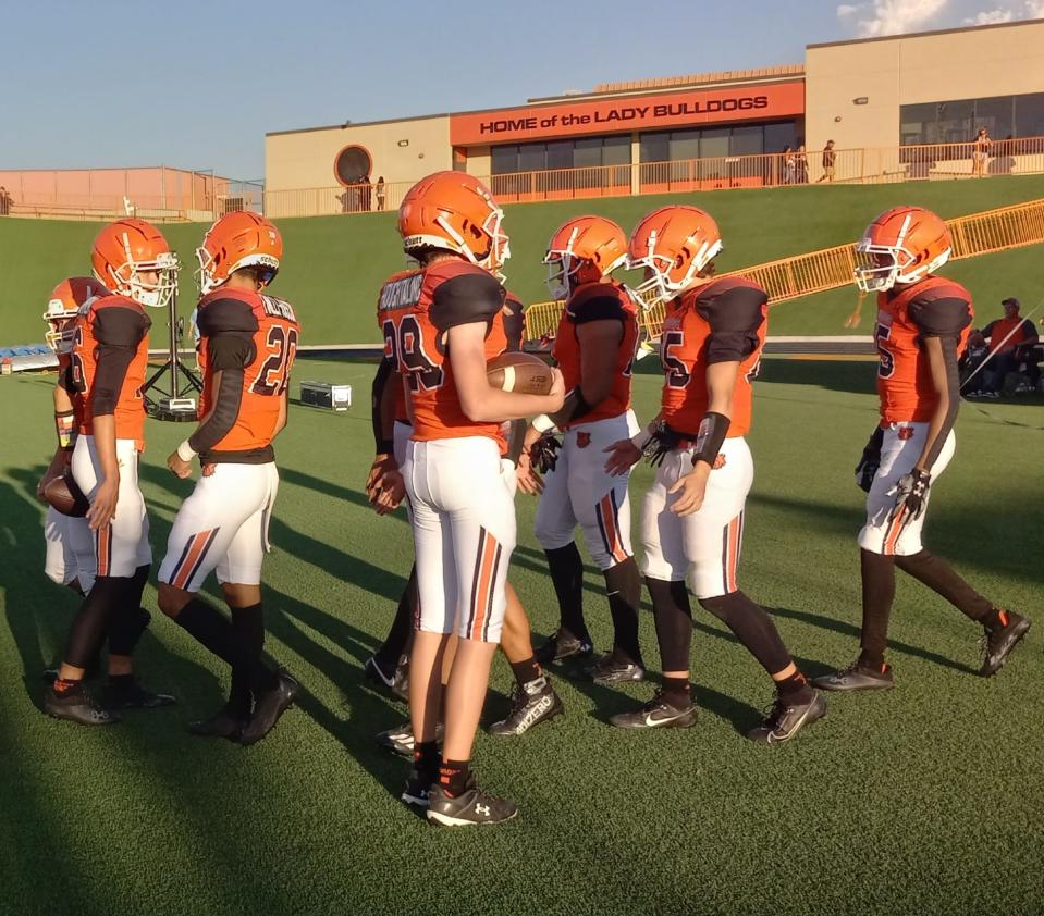 Some Artesia Bulldog football players prepare for the Sept. 15, 2023 game against Rio Rancho Cleveland. The Bulldogs defeated the 2022 large school champions.
