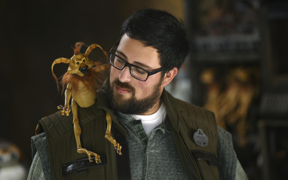 Disneyland employee Drew Mortazai displays a Kowakian monkey-lizard toy during the Star Wars: Galaxy's Edge Media Preview at Disneyland Park, Wednesday, May 29, 2019, in Anaheim, Calif. (Photo by Chris Pizzello/Invision/AP)