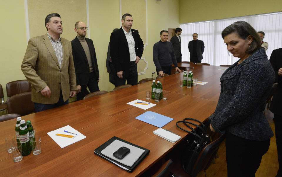 FILE - In this Dec. 10, 2013, file photo, U.S. Assistant Secretary for European and Eurasian Affairs Victoria Nuland, right, takes her place prior to the meeting with Ukrainian opposition leaders, from left, Oleh Tyahnybok, Arseniy Yatsenyuk, and Vitali Klitschko in Kyiv, Ukraine. When Secretary of State Antony Blinken travels to Ukraine he’ll be carrying a tough anti-graft message and strong U.S. backing for the country’s response to Russian aggression. He’ll also be bringing along a familiar face in the Washington-Moscow tug-of-war over Ukraine: Victoria Nuland. The mere presence in Kyiv of Nuland, now the No. 3 State Department official, is likely to irritate Russia. (AP Photo/Andrew Kravchenko, Pool, File)