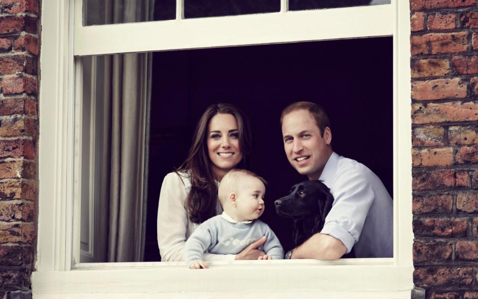 The Duke and Duchess of Cambridge, along with Prince George and Lupo in 2014 - Getty Images 