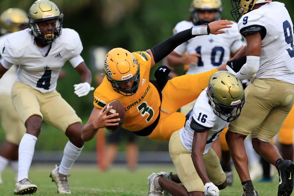 Ed White quarterback Jaylen Pettway (3) dives for a two-point conversion against Sandalwood.