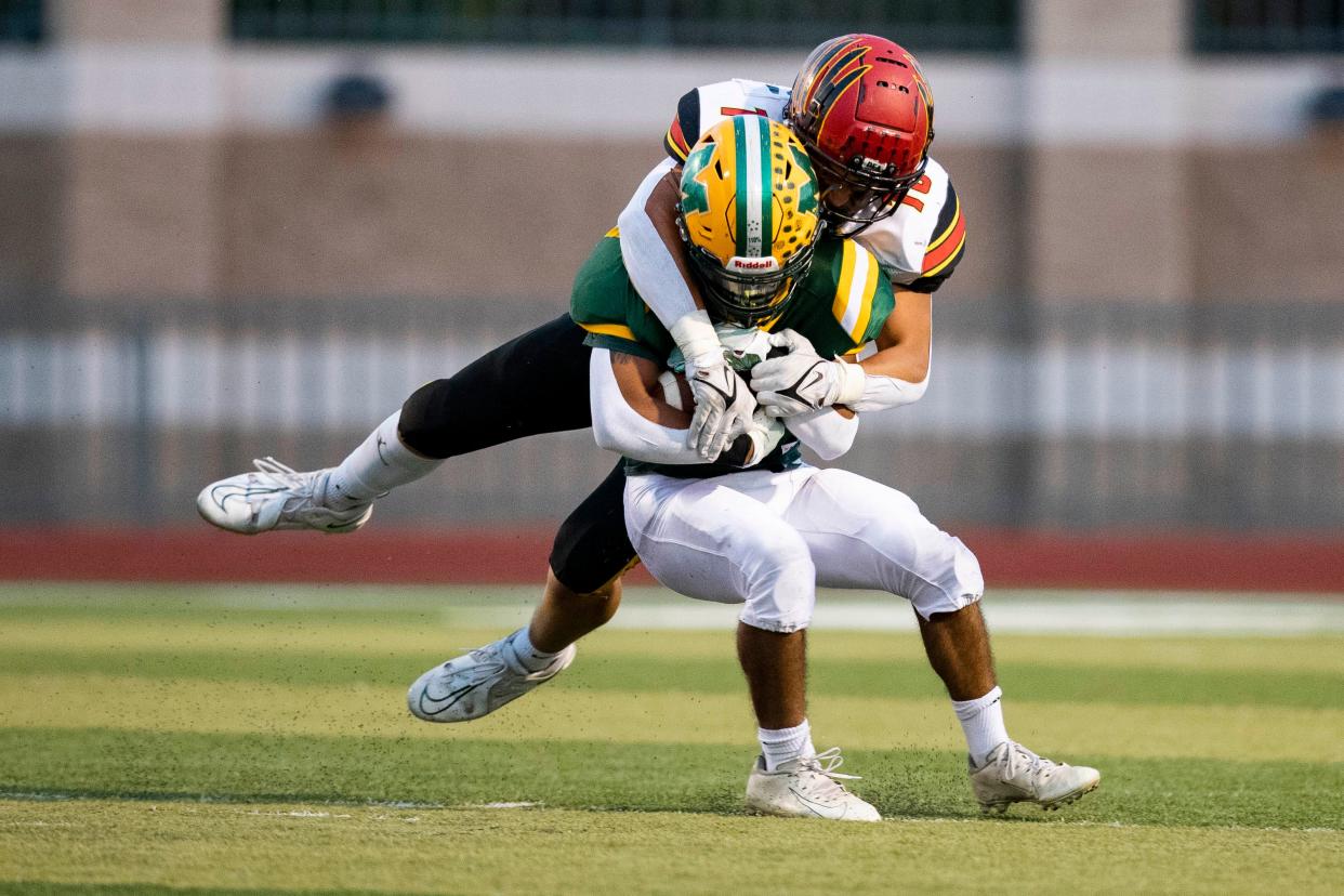 Centennial outside linebacker John Sierra tackles a Mayfield player during a high school football game on Friday, Sept. 9, 2022, at the Field of Dreams. 