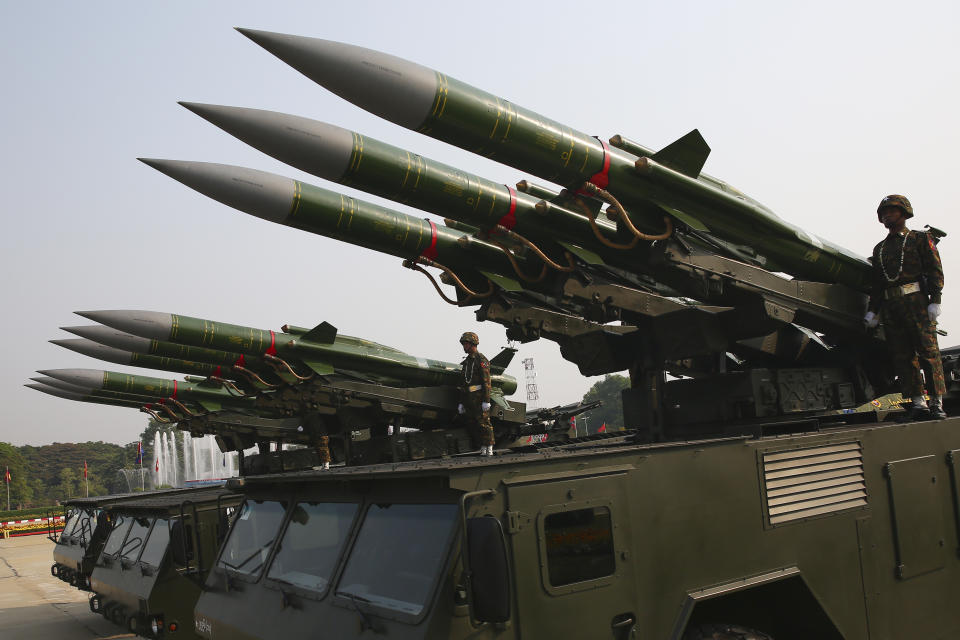 Myanmar's military officers stand atop trucks loaded with missiles during a parade to commemorate Myanmar's 78th Armed Forces Day in Naypyitaw, Myanmar, Monday, March 27, 2023. (AP Photo/Aung Shine Oo)