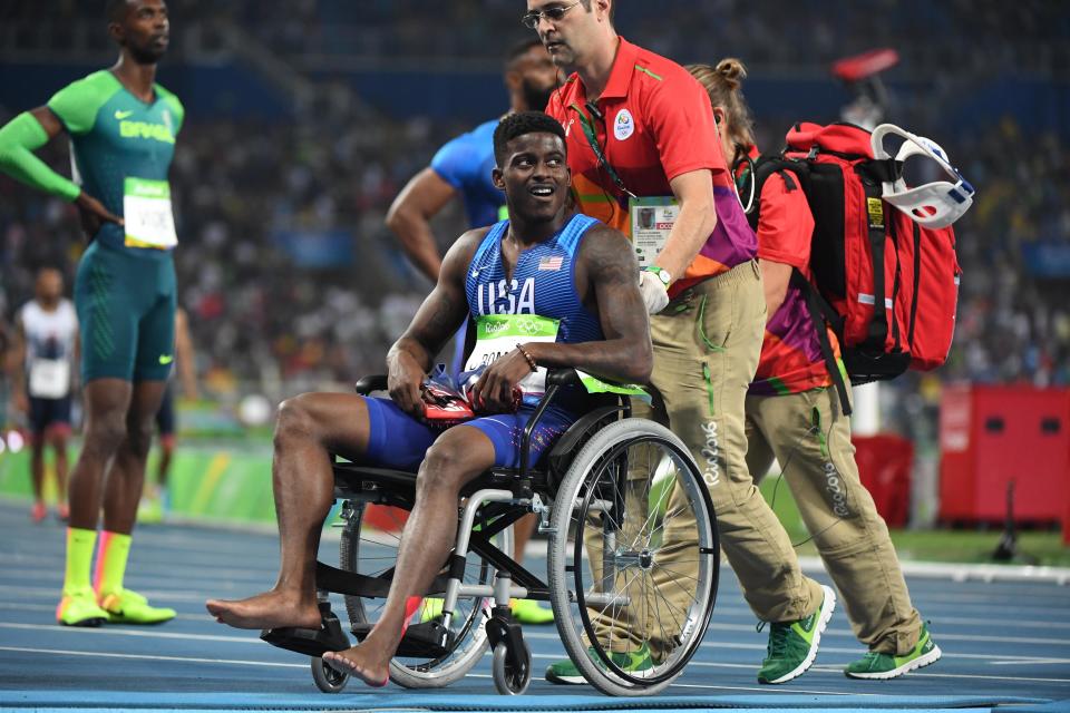 Trayvon Bromell (USA) in a wheelchair after the men's 4x100m relay final in the Rio 2016 Summer Olympic Games at Estadio Olimpico Joao Havelange.