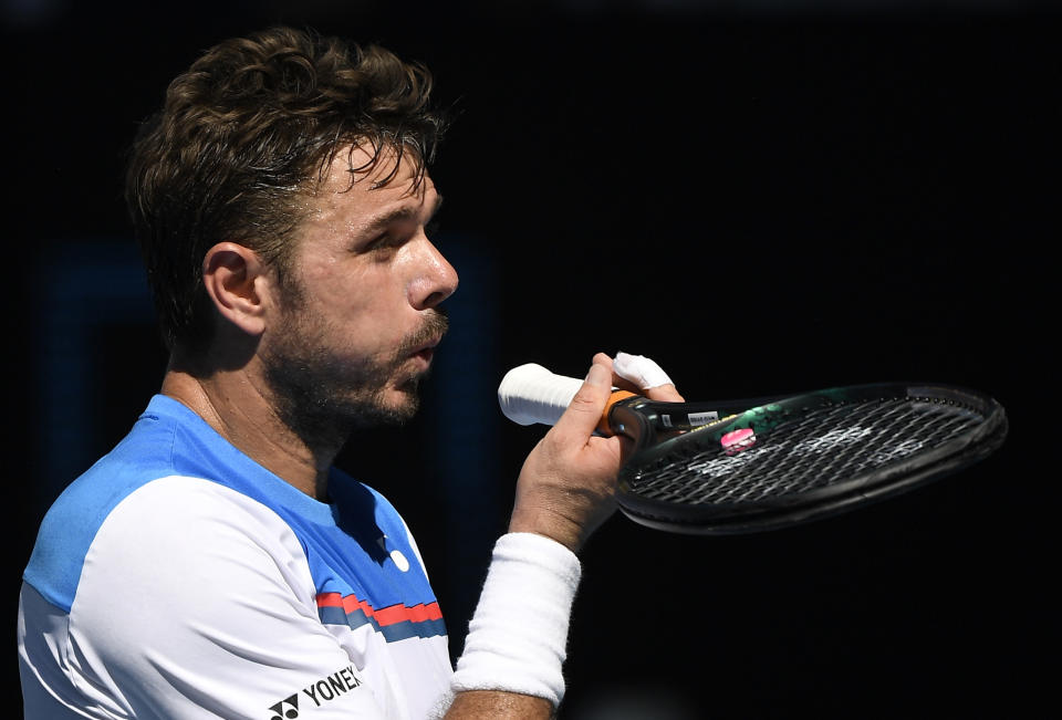 Switzerland's Stan Wawrinka reacts during his quarterfinal between Germany's Alexander Zverev at the Australian Open tennis championship in Melbourne, Australia, Wednesday, Jan. 29, 2020. (AP Photo/Andy Brownbill)