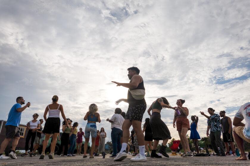 LOS ANGELES, CA - SEPTEMBER 09: Participants dance at sunset during the Natural High alcohol-free party at Elysian Park in Los Angeles, CA on Saturday, Sept. 9, 2023. (Myung J. Chun / Los Angeles Times)