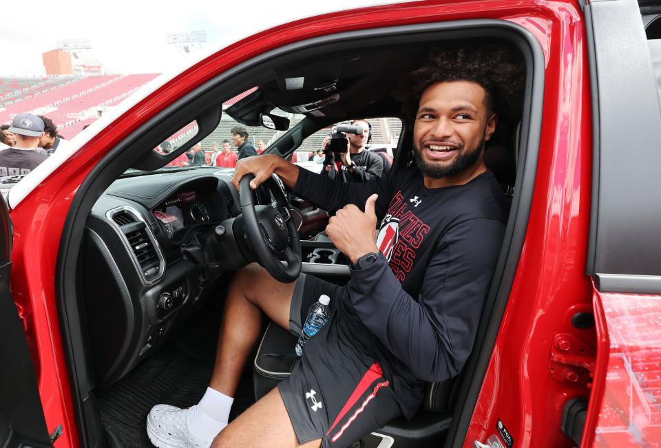 Utah Utes Levani Damuni celebrates getting a Dodge truck given to each player by the Crimson Collective during an NIL announcement at Rice-Eccles Stadium in Salt Lake City on Wednesday, Oct. 4, 2023. | Jeffrey D. Allred, Deseret News