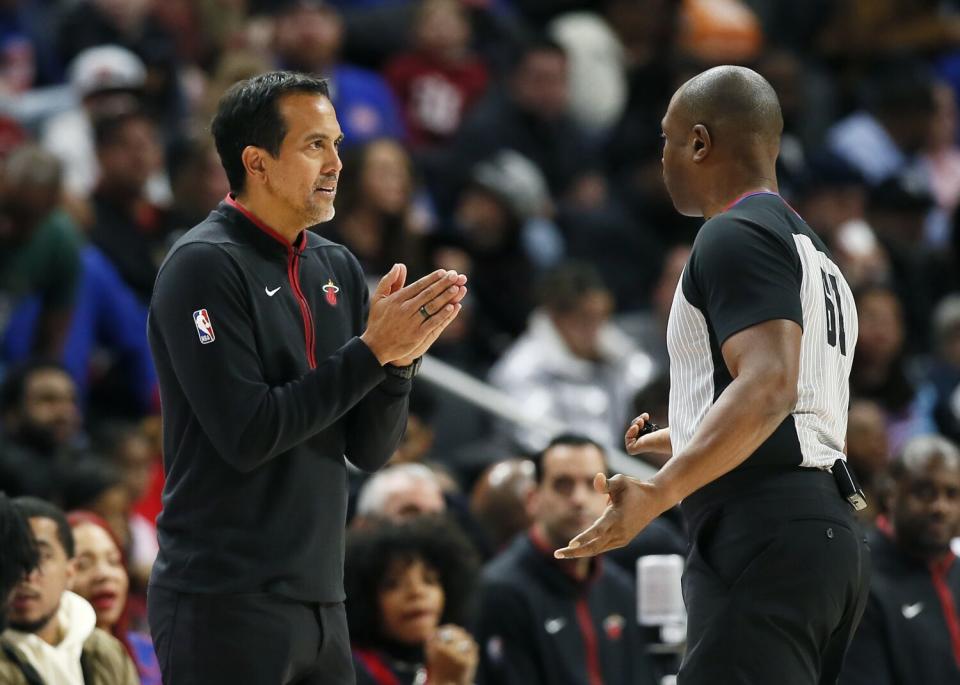 Miami Heat coach Erik Spoelstra talks with referee Courtney Kirkland.