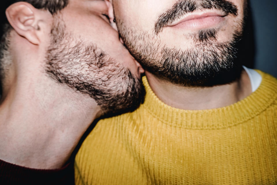 Gay couple kissing on the neck