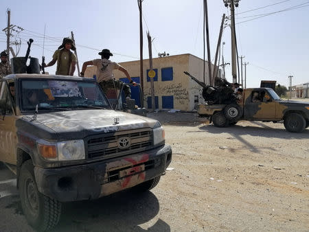 Troops from eastern Libyan forces are seen in Ain Zara, south of Tripoli, Libya April 11, 2019. Picture taken April 11, 2019. REUTERS/Stringer