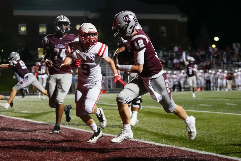 Columbus Academy quarterback Jack Yeoman runs for a touchdown against St. Charles on Sept. 14.