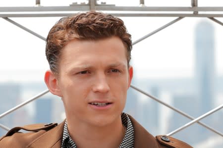 FILE PHOTO: Actor Tom Holland poses for a photograph on top of the Empire State Building to promote the film, Spider-Man: Far From Home in New York