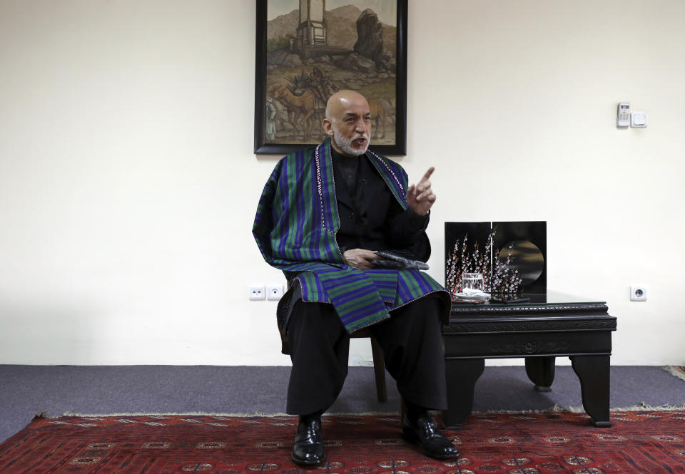 Former Afghan President Hamid Karzai speaks during an interview with the Associated Press in Kabul, Afghanistan, Thursday, March 11, 2021. Afghans are eager for peace and a recently floated U.S. draft for a deal between Taliban insurgents and the Afghan government is the best chance to accelerate stalled peace talks, ex-president Hamid Karzai said in an interview Thursday. (AP Photo/Rahmat Gul)